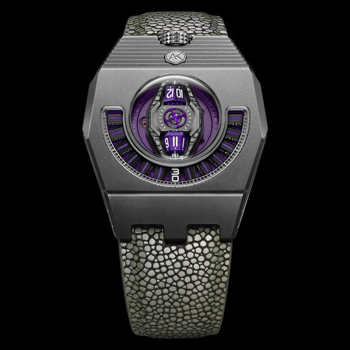 Luxury watch with purple face and textured band on a black background
